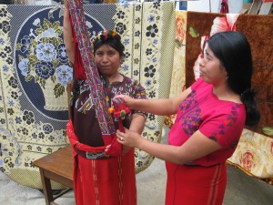 An Ixil woman with traditional weaving.